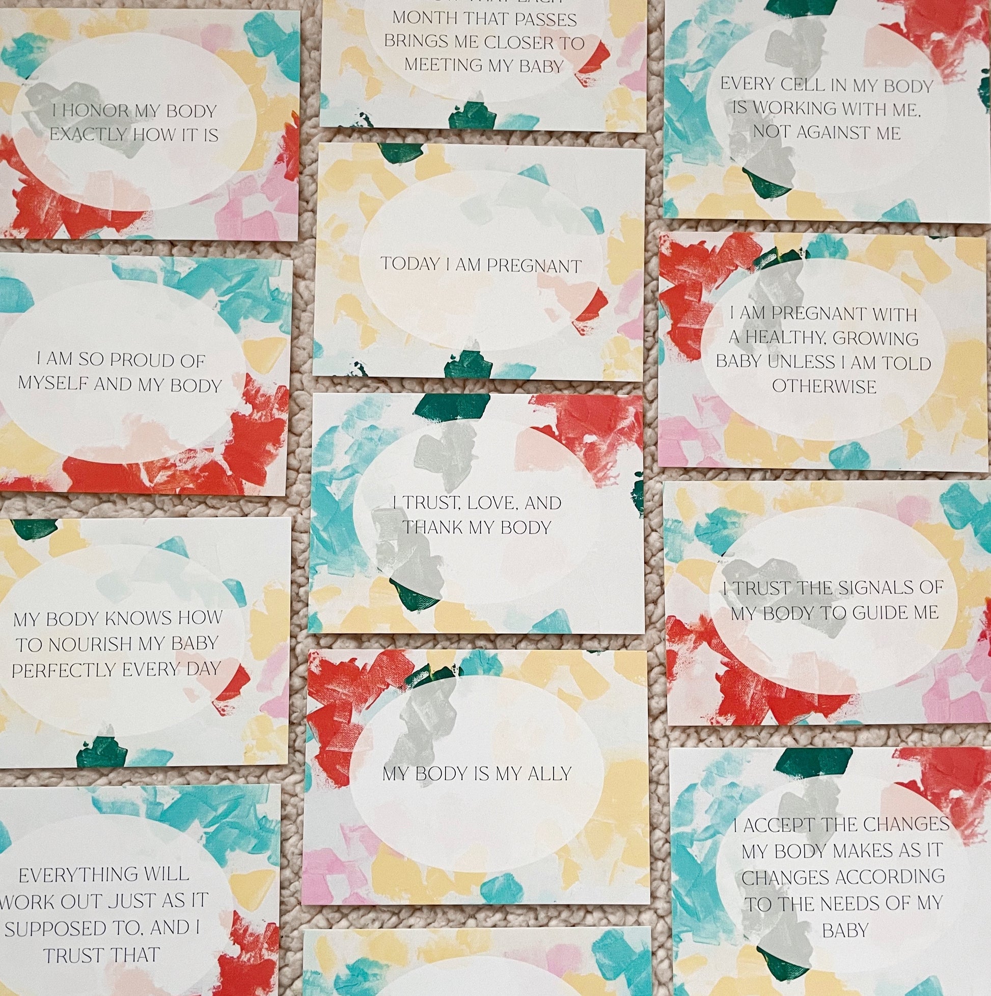 pregnancy affirmation cards with colorful abstract art
