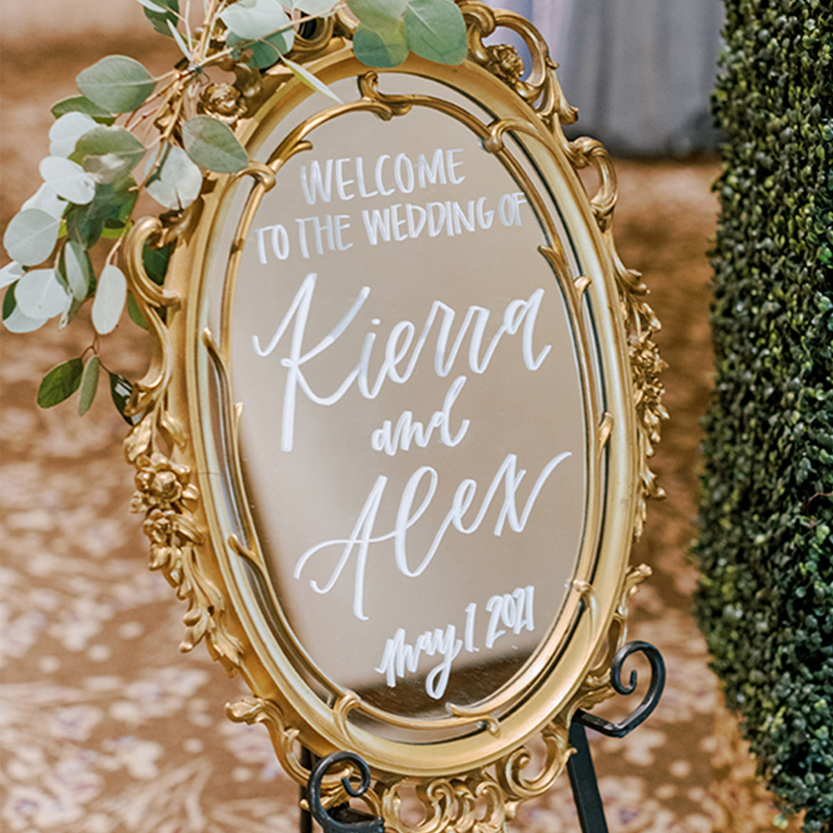 calligraphy of wedding welcome sign on mirror 